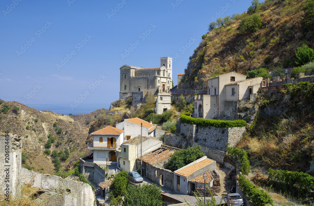 The view of old buildings in mountain village Savoca in Sicily, Italy