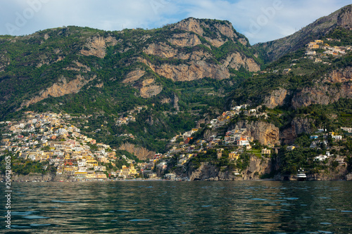 The beautiful Village of Positano at the Italian Amalfi Coast seen from the turquoise Sea on a sunny Morning