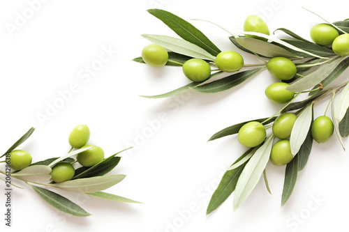 green olives on white background. frame background with copy space photo