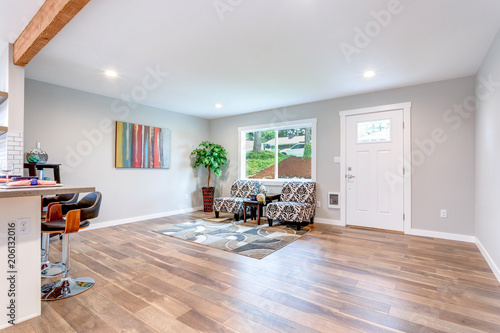 Open concept home interior with hardwood floor.