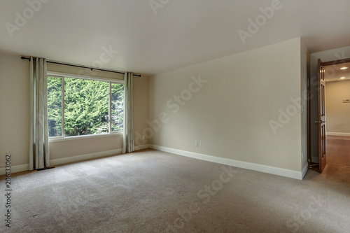 Empty bedroom with carpet floor.