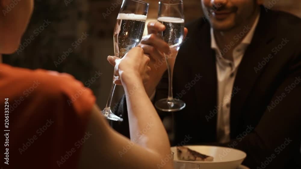Romantic loving couple having a dinner date and toasting