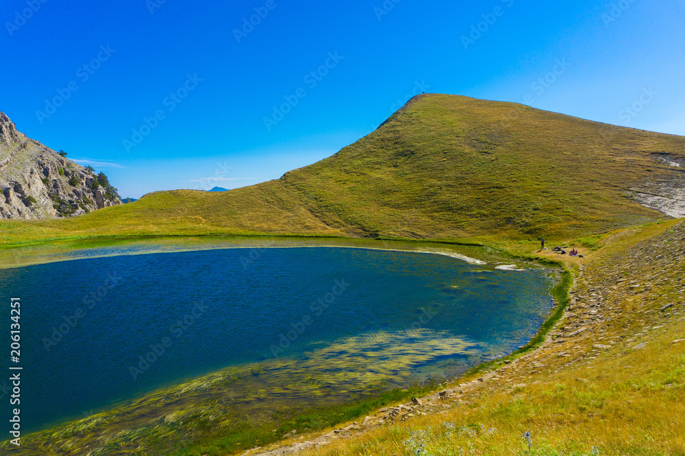 Tymfi Dragon lake (drakolimni) in the reserve area of the North Pindus Range of the Gamila crest (Tymfi’s highest peak). There are legendary tales that mythical creatures once inhabited the lake