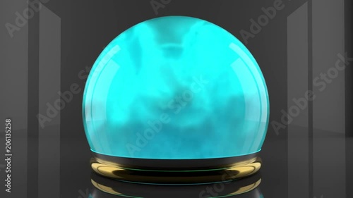 Crystal ball with fume particles motion. Cyan color gas inside a glass sphere. Design of liquid luminous smoke. photo