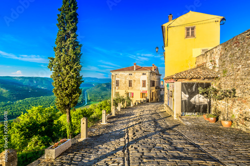 Motovun old town scenic. / Scenic view at medieval town Motovun in Croatia, city walls and promenade. photo