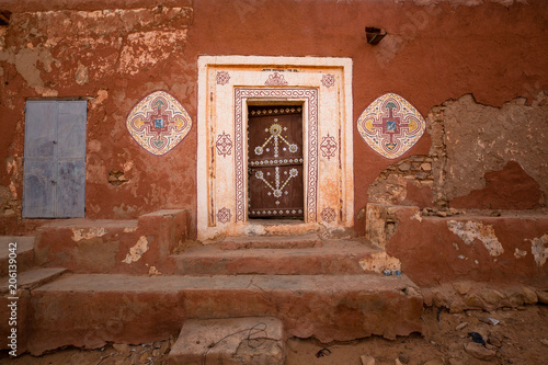 Famous ancient arabic door paintings at medieval bricked house in World Heritage Site Walata, Mauritania