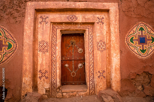 Famous ancient arabic door paintings at medieval bricked house in World Heritage Site Walata, Mauritania