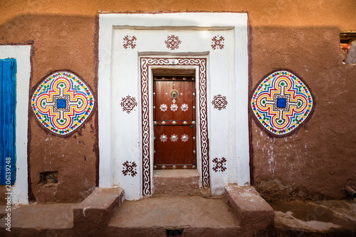 Famous ancient arabic door paintings at medieval bricked house in World Heritage Site Walata, Mauritania