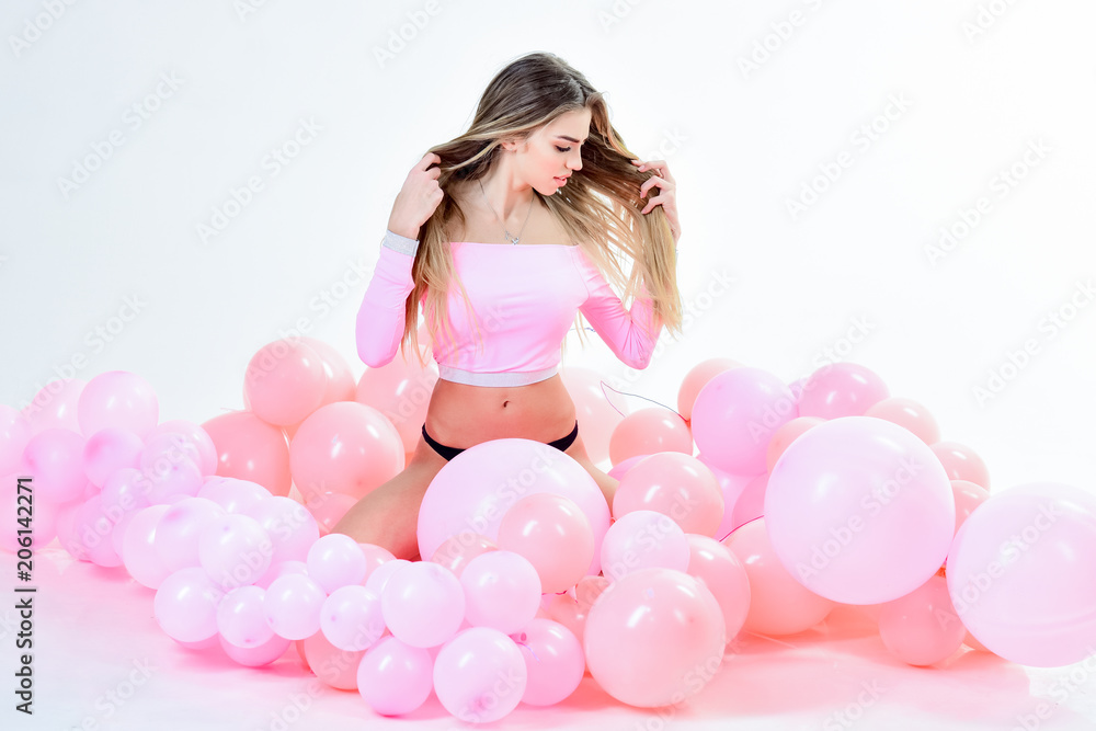 Balloon. Balloon party. Blonde woman in sport dress with pink balloons. Healthy lifestyle. Party mood. Party concept. Sport concept. Sport costume. Balloon. Balloon party. Blonde woman in sport dress with pink balloons. Healthy lifestyle. Party mood. Party concept. Sport concept. Sport costume.