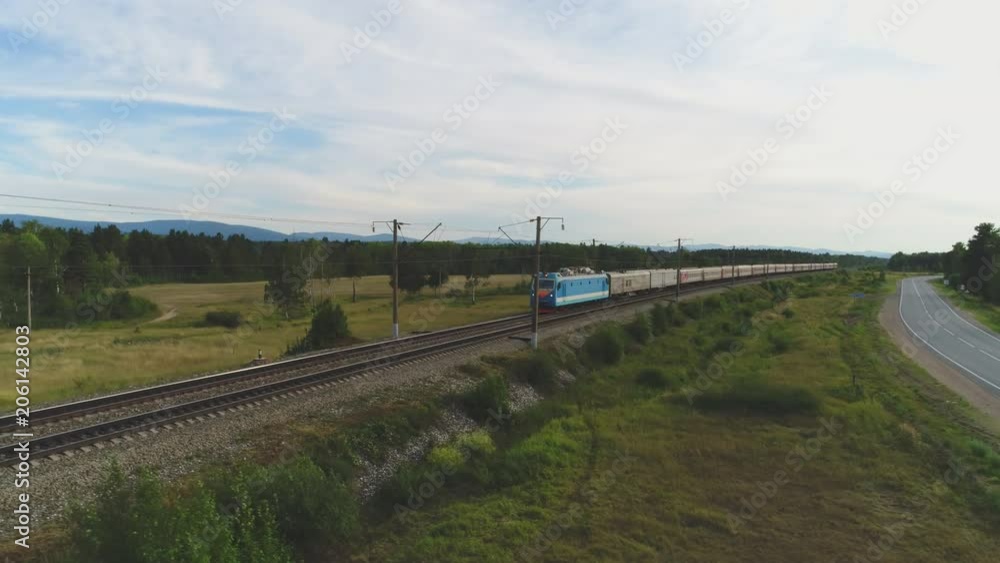 Freight train with cisterns and containers on the railway. Aerial view ...