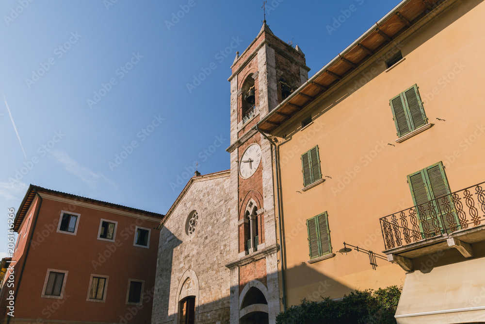 low angle view of buildings and clear blue sky in Tuscany, Italy