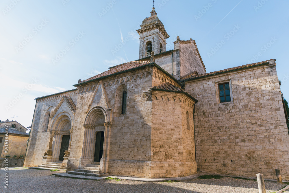scenic view of historical church and clear blue sky in Tuscany, Italy