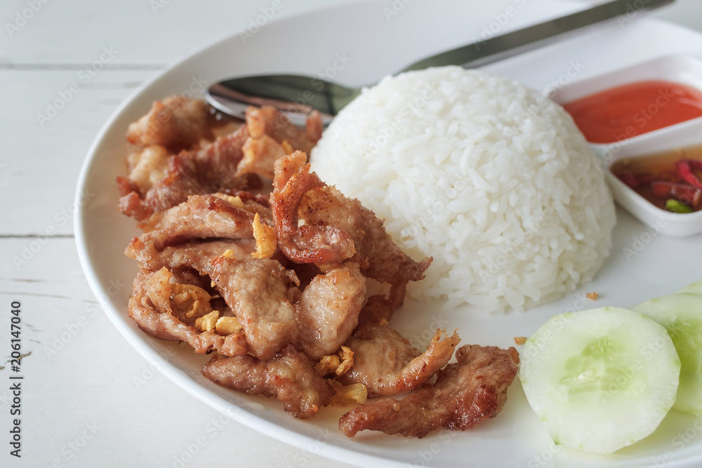 fried pork with garlic topping with jasmine rice, simple menu thai food fried pork with garlic topping with jasmine rice, simple menu thai food