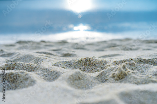 single focused beach sand with the sun and sea