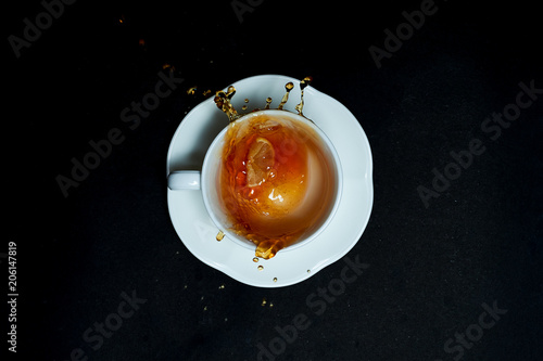 Cup of tea on black background