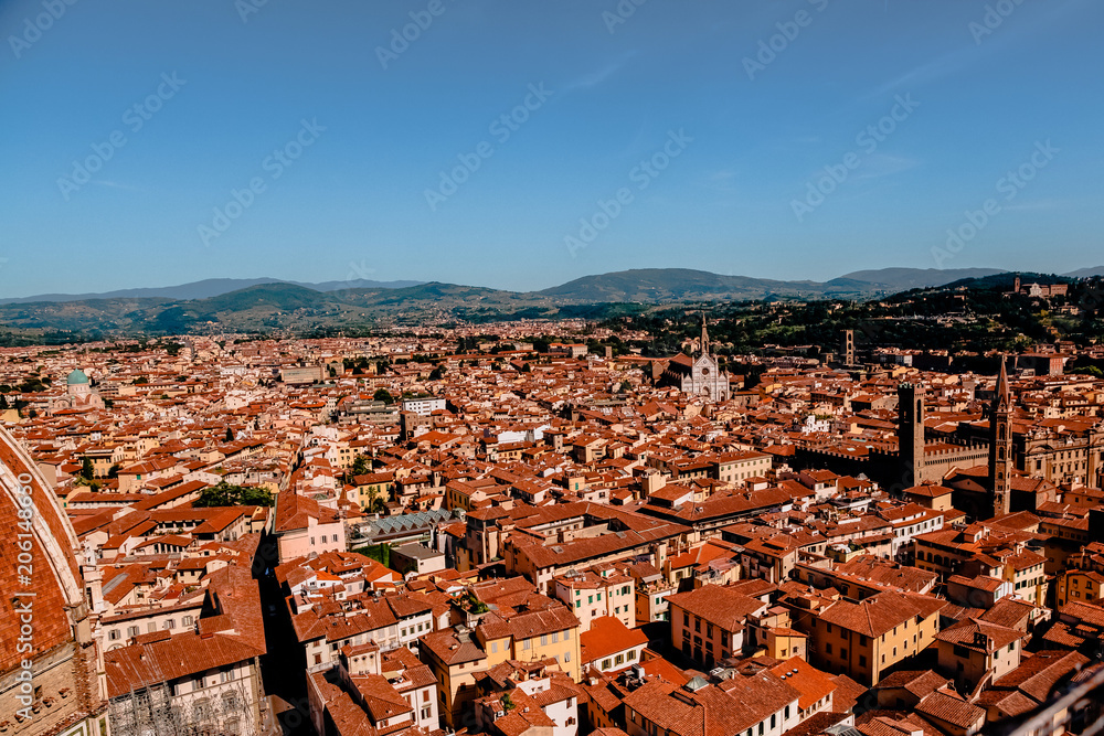 FLORENCE, ITALY - JULY 17, 2017: aerial view of beautiful cityscape with historic buildings and rooftops in florence, italy