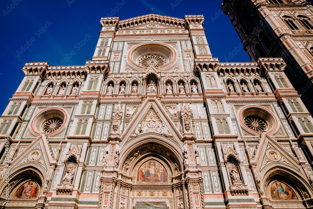 low angle view of famous Duomo Cathedral with Giotto Bell Tower in Florence, Italy