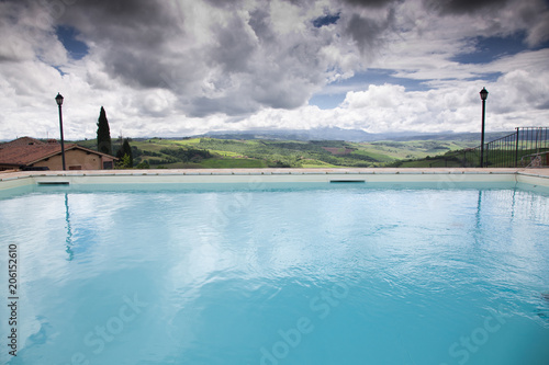 swimming pool against beautiful landscape in Tuscany © Melinda Nagy