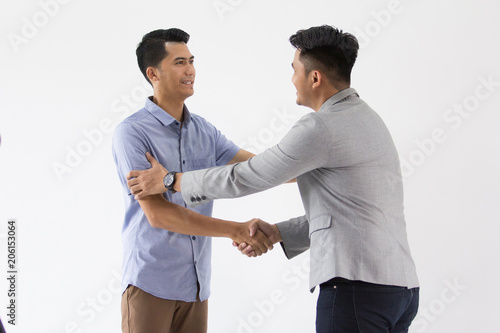 Asian Young Business shake hand deal