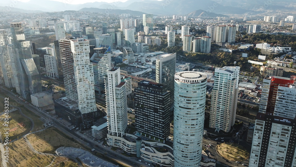 Aerial view of Santa Fe Mexico buildings and skyscrapers with mountain as background 