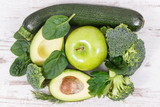 Green fruits and vegetables containing natural minerals, vitamins and fiber, healthy nutrition concept