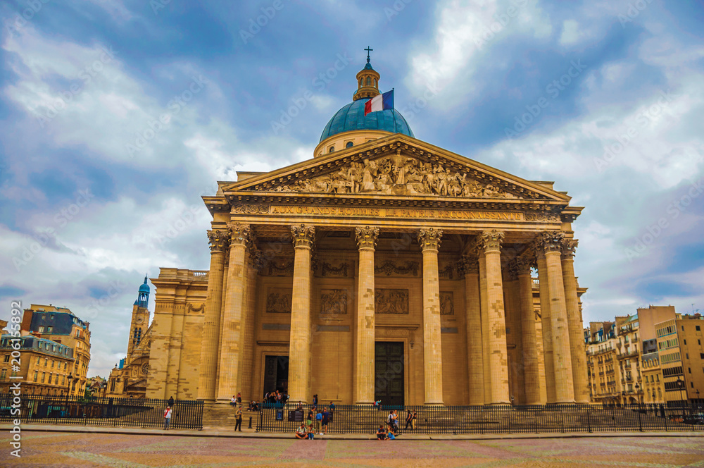 Facade of the Pantheon in Neoclassical style, with dome and columns at the entrance in Paris. Known as one of the most impressive world’s cultural center. Northern France. Retouched photo.