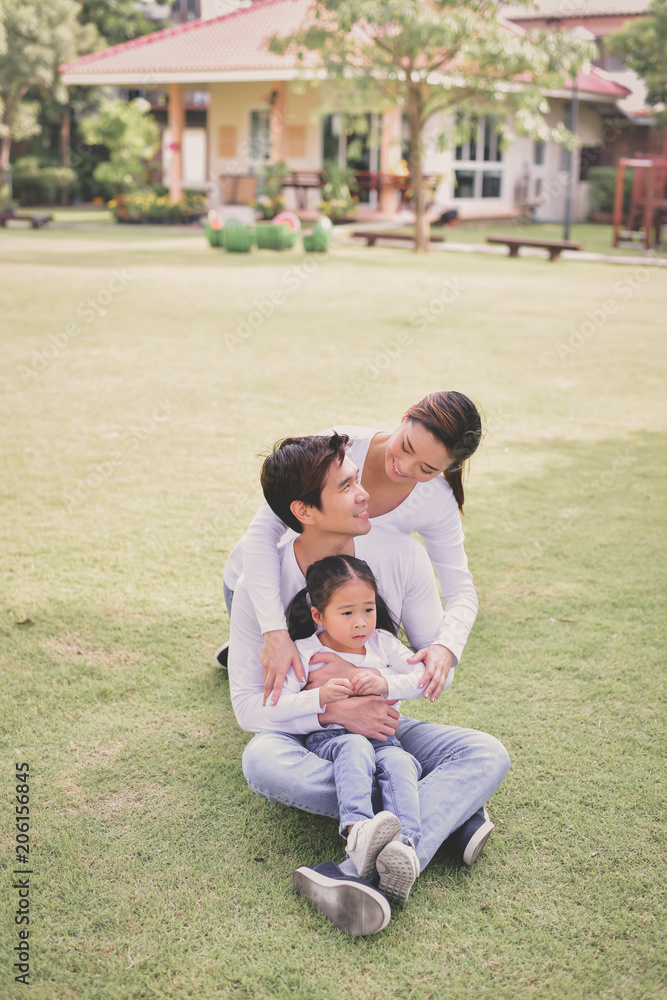 Family Concept. Happy male and female playing with children outside. Family is doing happy activities at Playground. Parents are playing happily. Family Concept. Happy male and female playing with children outside. Family is doing happy activities at Playground. Parents are playing happily.