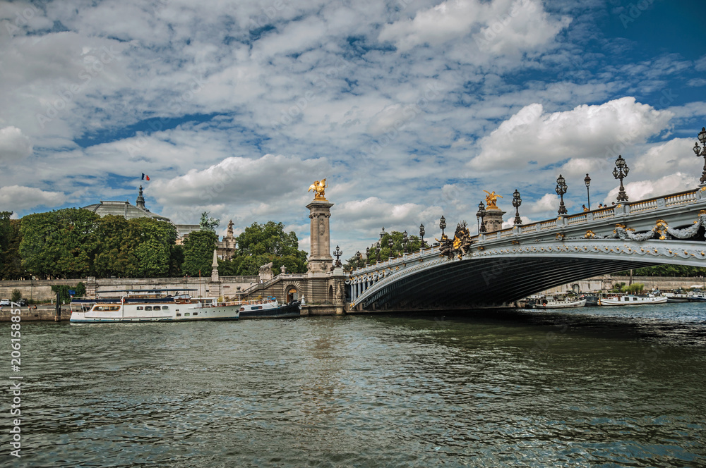 Alexandre III bridge, Grand Palais building and boats anchored at Seine River bank in Paris. Known as the “City of Light”, is one of the most impressive world’s cultural center. Northern France. Alexandre III bridge, Grand Palais building and boats anchored at Seine River bank in Paris. Known as the “City of Light”, is one of the most impressive world’s cultural center. Northern France.