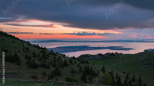 Landscape view of Croatian islands in the Adriatic sea from the Velebit mountain during a beautiful colorful sunset, national park Velebit in Croatia