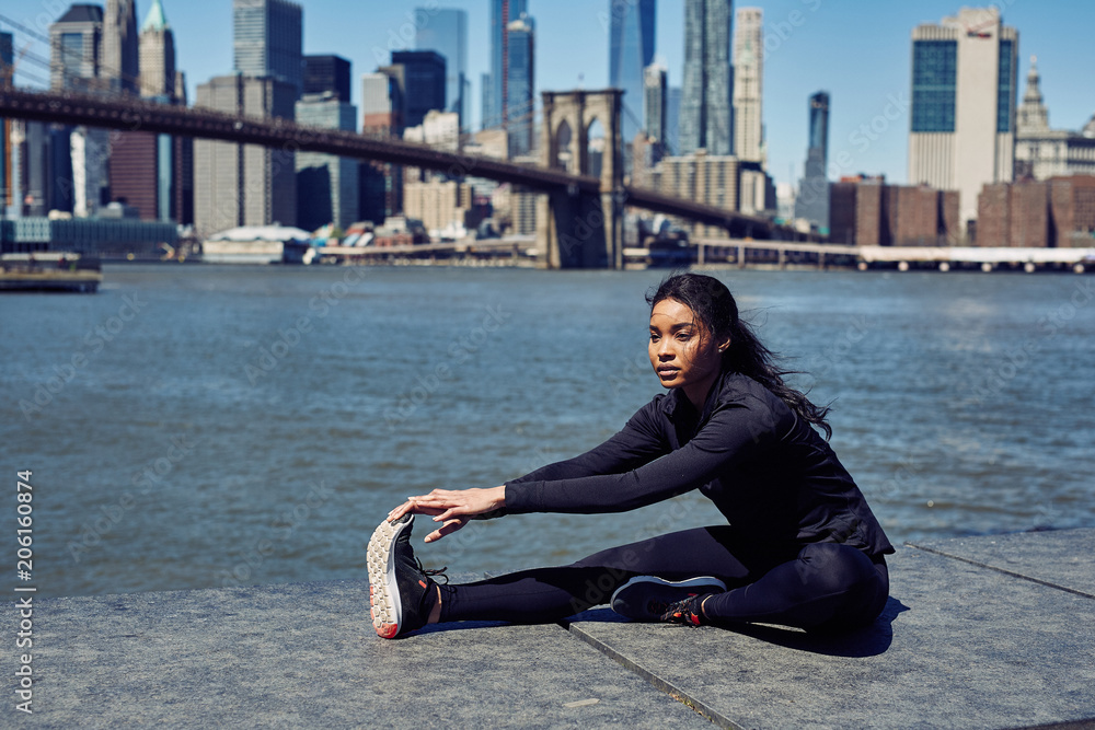 Pretty Black Woman Stretches Before Her Run Pretty Black Woman Stretches Before Her Run