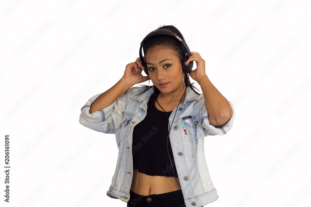 Stylish woman in short blouse, denim jacket with headphones. Front pose  Stock Photo | Adobe Stock