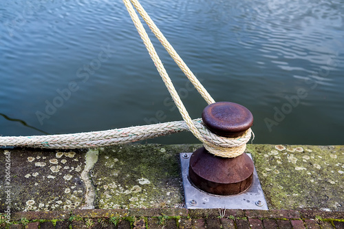 Marina bollard (bitt) to tie mooring ropes for yachts mooring © Olena Ilienko