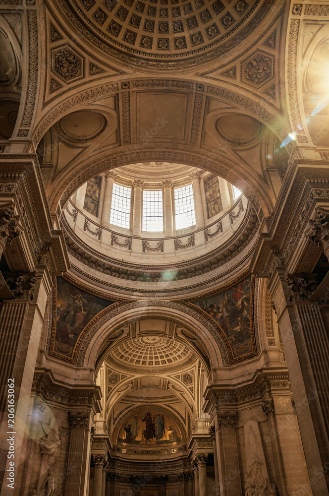 View of the richly decor at Pantheon dome and sunlight in Paris. Known as one of the most impressive world’s cultural center. Northern France.