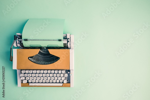 Flat lay of retro hipster typewriter pastel abstract concept. photo
