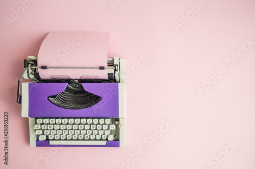 Flat lay of retro hipster typewriter pastel abstract concept.