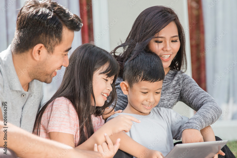 modern young family using tablet modern young family using tablet