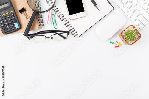 office desk with smartphone, computer and office supplies top view