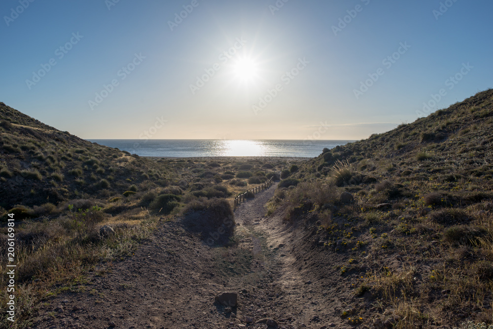 The beach of the dead with the sun and the blue sky