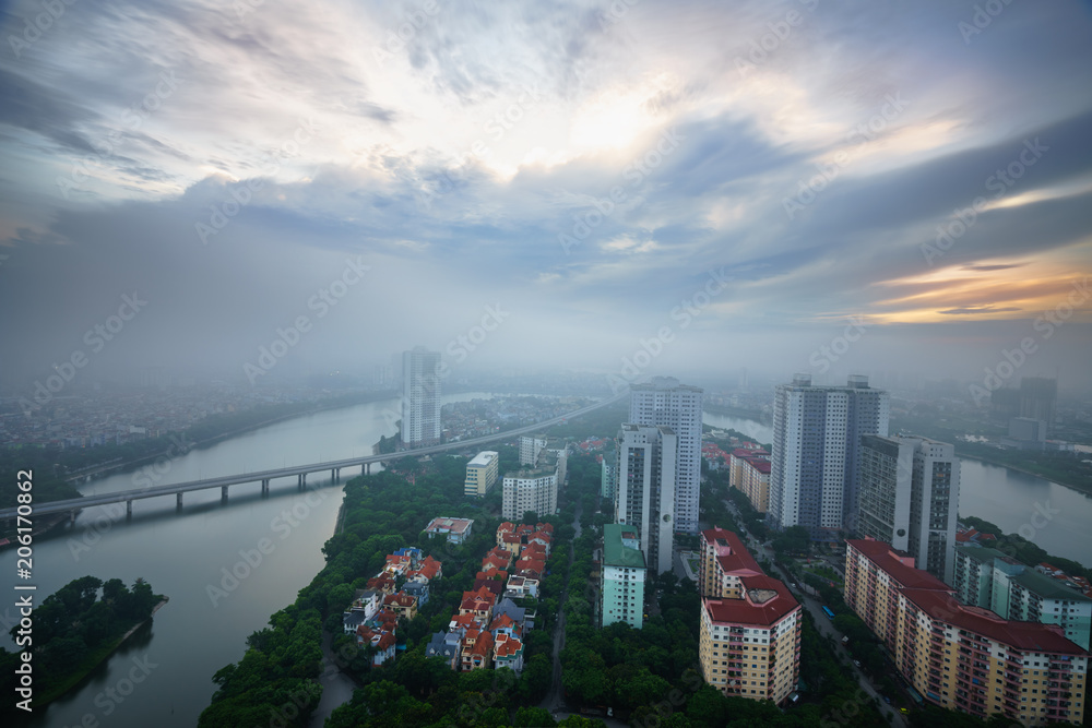 Obraz premium Aerial skyline view of Hanoi cityscape at dawn with low clouds. Linh Dam peninsula, Hoang Mai district.