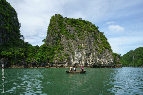 Halong bay in Vietnam, UNESCO World Heritage Site, with tourist rowing boats