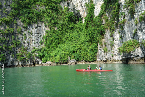 Halong bay in Vietnam  UNESCO World Heritage Site  with paddling kayak.