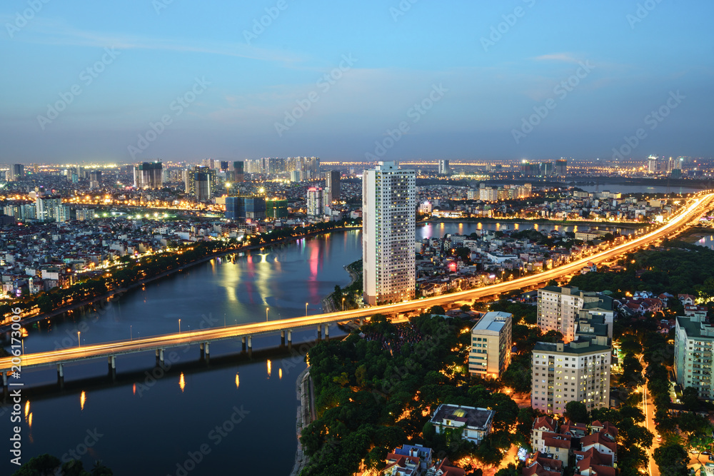 Fototapeta premium Aerial skyline view of Hanoi cityscape at twilight. Linh Dam peninsula, Hoang Mai district, Hanoi, Vietnam