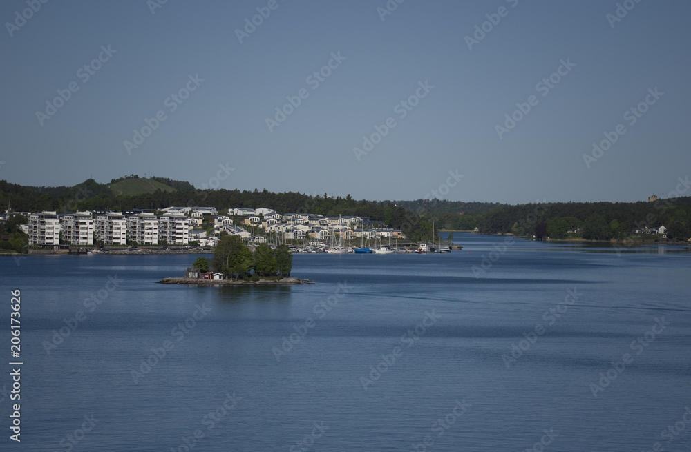 Naklejka premium Waterwiev of Stockhlm harbor a early moning in spring. Gåshaga and the small island Svanholmen in Lidingö, Stockholm, Sweden