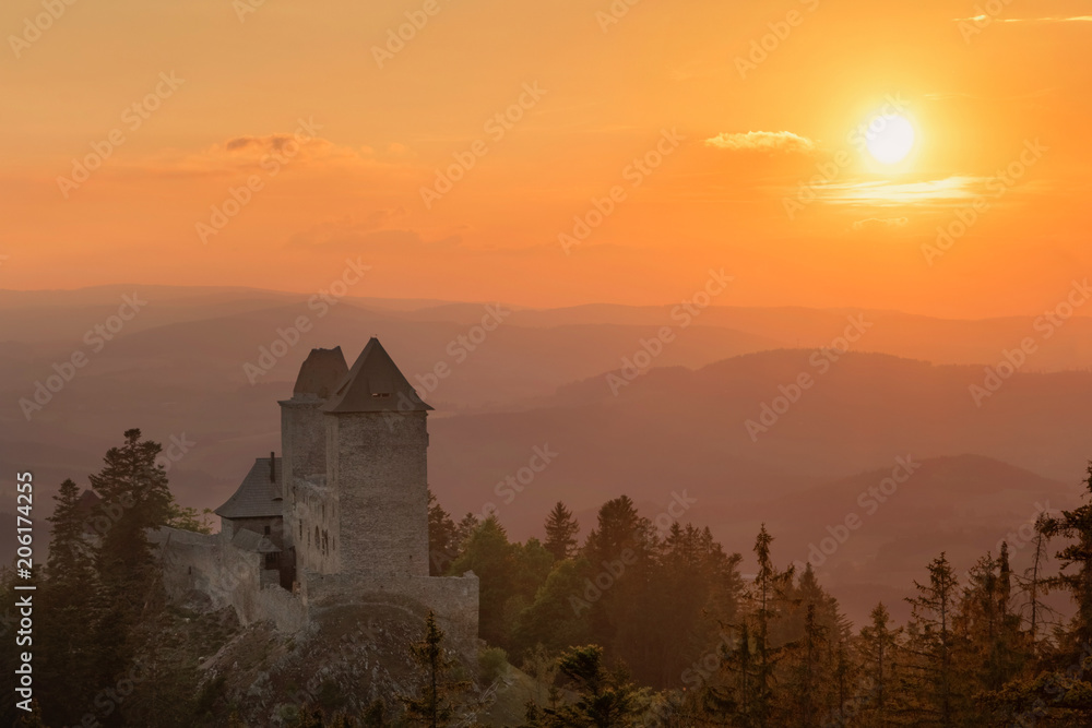 Golden sunset in Kasperk castle, Sumava, Czech Republic. Hills and villages in the fog, misty view on Czech landscape, evening scene. Golden sunset in Kasperk castle, Sumava, Czech Republic. Hills and villages in the fog, misty view on Czech landscape, evening scene.