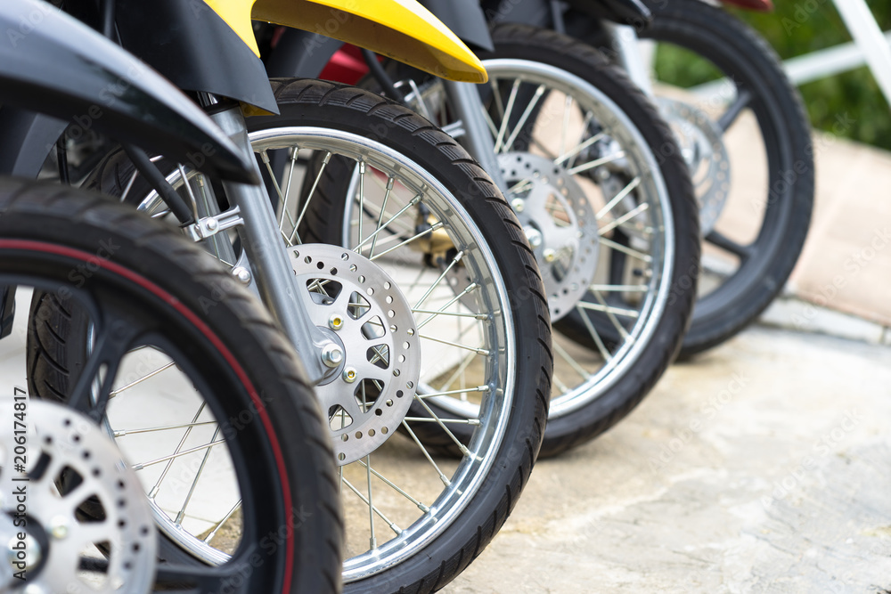 Motorcycles standing in the row at a store, closeup