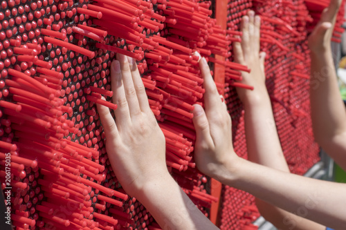 Children play a developing game for tactility.