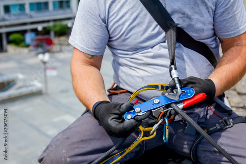 Industrial climber is prepare his ropes