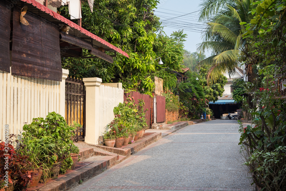 Idyllic side street in Luang Prabang, Laos, on a sunny day. Idyllic side street in Luang Prabang, Laos, on a sunny day.