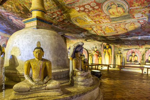 The golden temple of Dambulla is world heritage site and has a total of a total of 153 Buddha statues, three statues of Sri Lankan kings and four statues of gods and goddesses photo