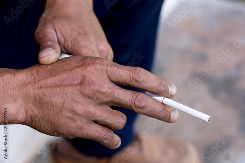 Human hand using cigarette health concep